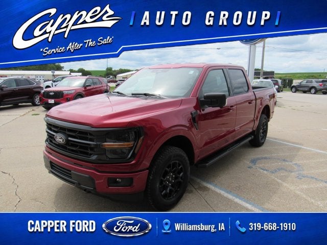 2026 Ford F-150 XLT in Ruby Red Metallic Tinted Clearcoat — front three-quarter view